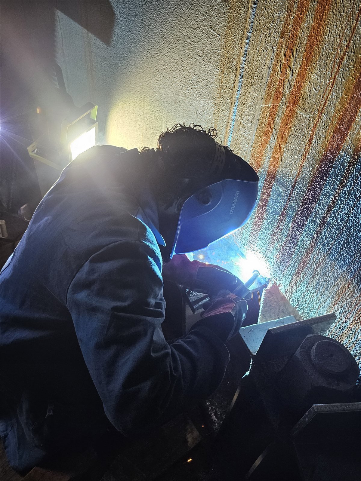 Welding new bolt chairs inside the chimney base
