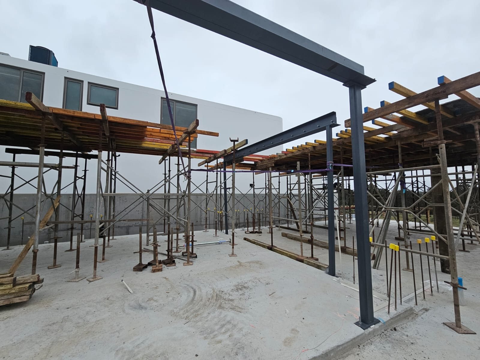 Steel columns and beams installed on slab