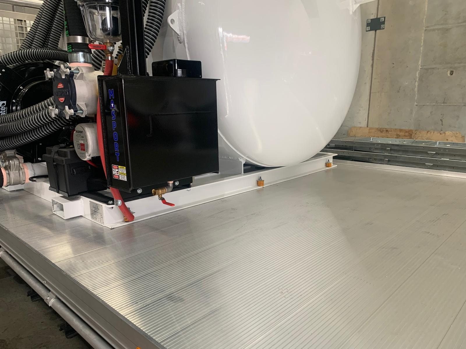 Vacuum tank mounted on the truck tray